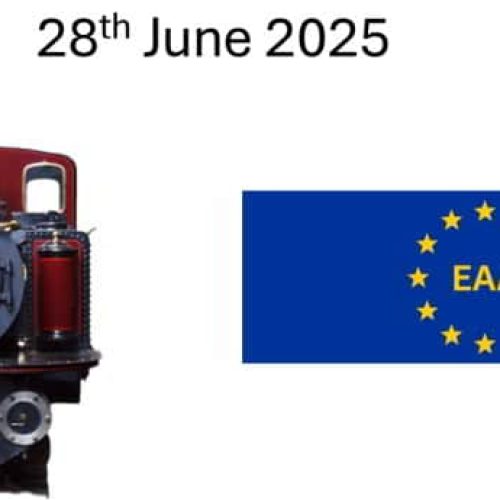 A steam train and a blue flag with yellow stars, marked 
