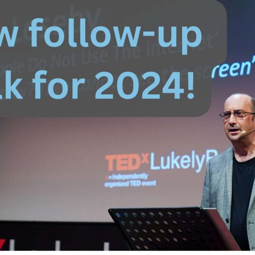 A man stands on stage speaking at a TEDx event with large text behind him that reads New follow-up talk for 2024!.